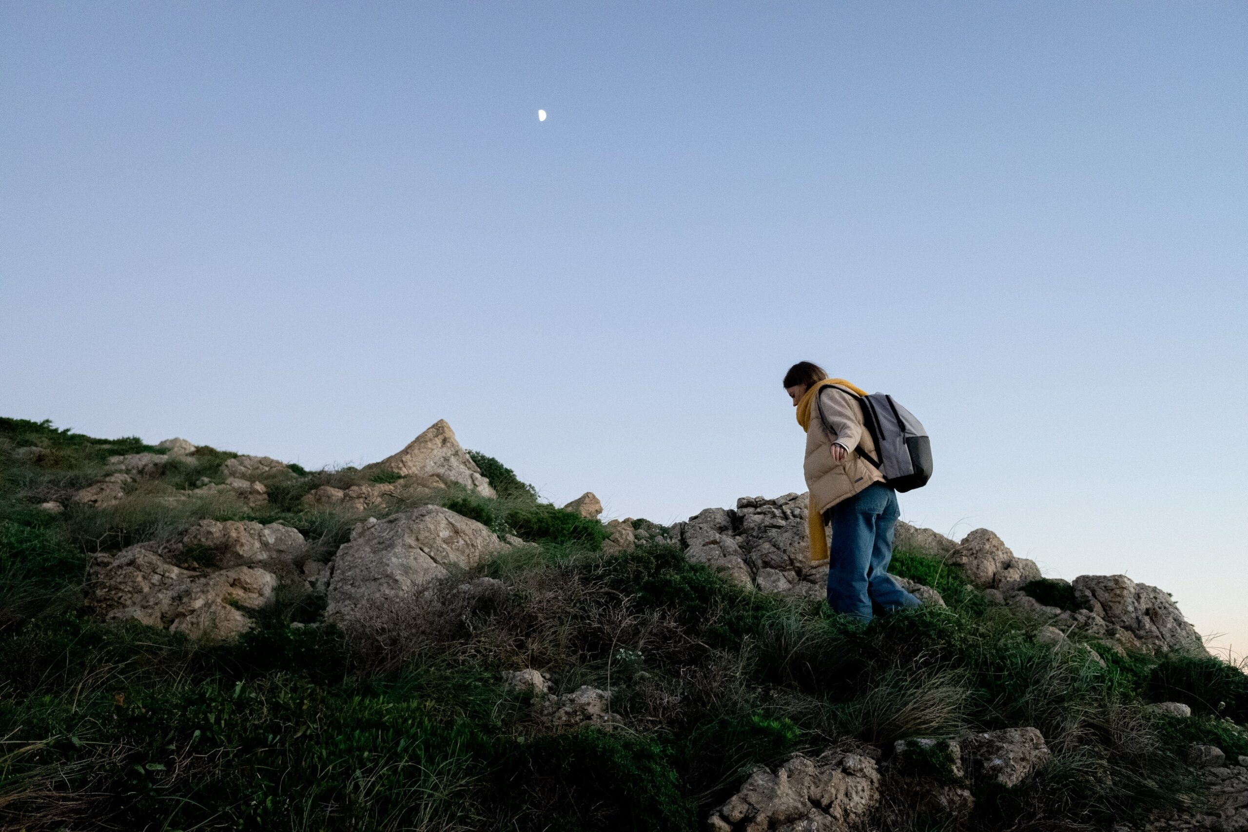 woman hiking a rocky terrain