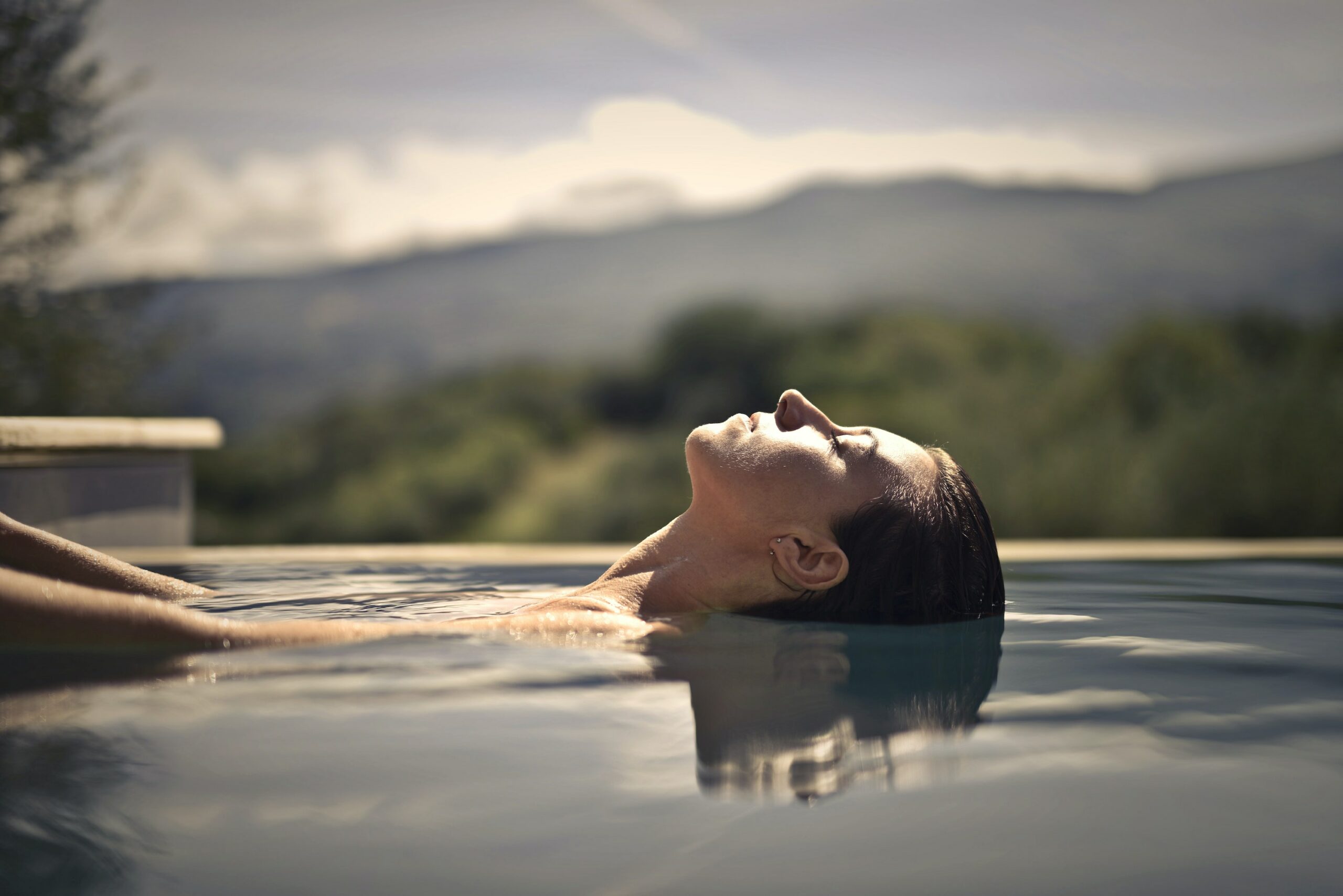 woman floating in pool