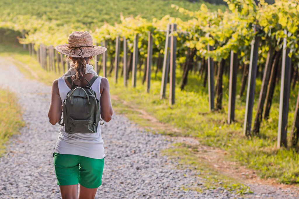 woman hiking in vineyard